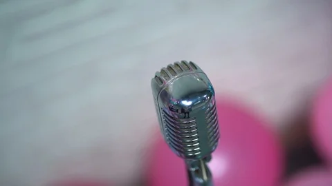 Silver retro glare microphone on scene close up. Light shine on mic. Top view. Stock Footage 119978801