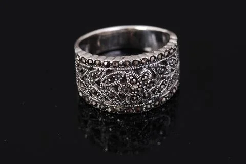 Silver ring on black background Stock Photos