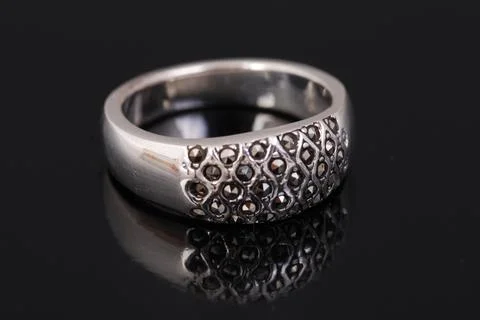 Silver ring on black background Stock Photos