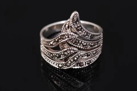 Silver ring on black background Stock Photos