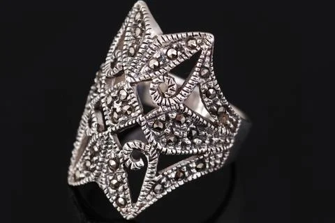 Silver ring on black background Stock Photos