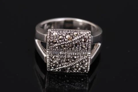 Silver ring on black background Stock Photos