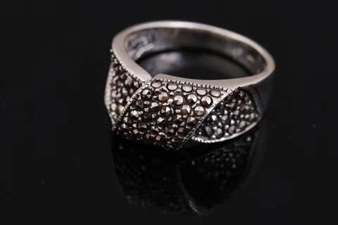 Silver ring on black background Stock Photos