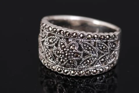 Silver ring on black background Stock Photos