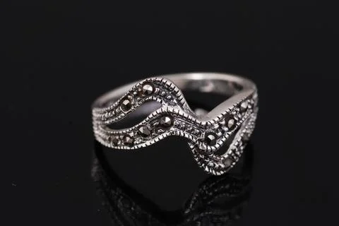 Silver ring on black background Stock Photos