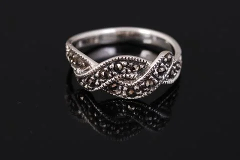 Silver ring on black background Stock Photos