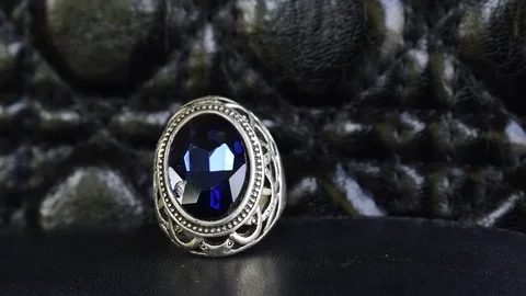 Silver ring decorated with The blue sapphire Stock Footage 125171194