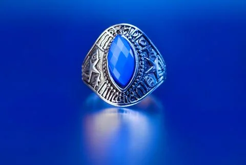 Silver ring featuring a large faceted blue stone Stock Photos
