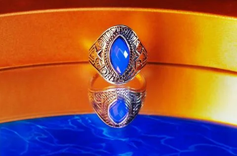 Silver ring featuring a large faceted blue stone Stock Photos