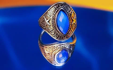 Silver ring featuring a large faceted blue stone Stock Photos