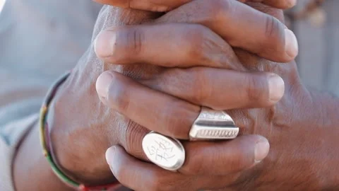 Silver ring in the hand of a dark man. Stock Footage 145654370