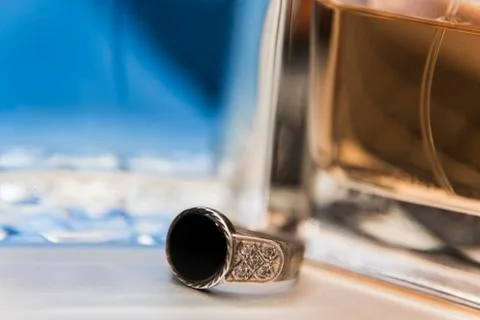 Silver ring, perfume and computer Fotos Stock