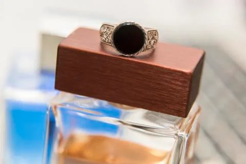Silver ring, perfume and computer Fotos Stock