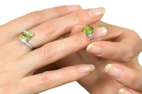 Silver ring with peridot on finger Stock-Fotos