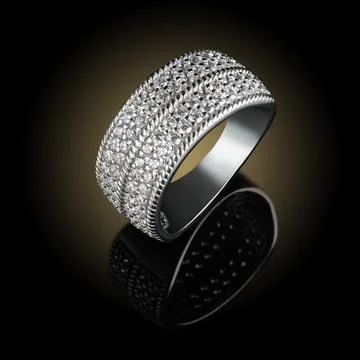 Silver ring with a reflection on a black background 写真素材