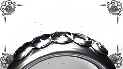 Silver ring rotating on camera pullback, revealing gems and filigree corners Stock Footage 339448710