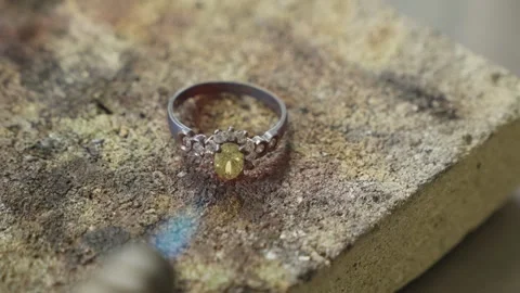 Silver Ring With Yellow Gemstone On Goldsmith Workbench Stock Footage 340595209