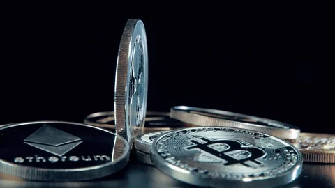 SIlver Ripple coin on black background. Silver Crypto coin on spinning stand. Stock Footage 126906552