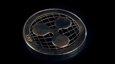 SIlver Ripple coin on black background. Silver Crypto coin on spinning stand. Stock Footage 126908030