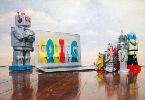 Silver robot teaching about code Stock Photos