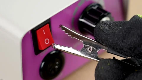 Silver ?rocodile clip on the background of an electrical device Video stock 278398541