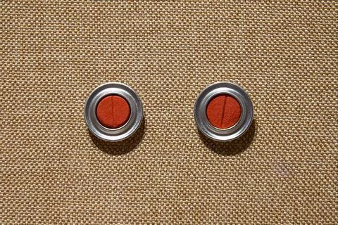 Silver round earrings with red core jewelry exhibits Stock Photos