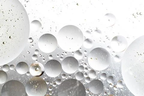 Silver round forms of water abstraction on a water basis Stock Photos