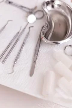 Silver scissors cutting white paper Stock Photos