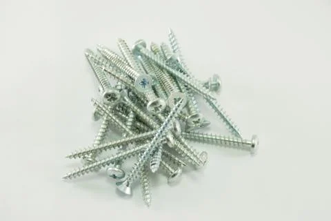 Silver screws located on a white background isolated Stock-Fotos