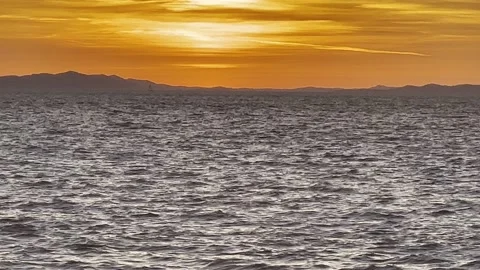 SILVER SEA ORANGE SKY Stock Footage 202172043