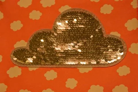 Silver Sequin Cloud Patch on Red Fabric Background symbolize cloud in IT area Stock Photos