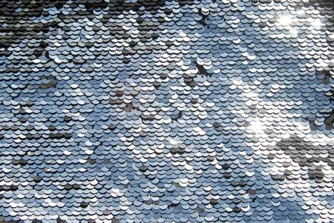 Silver sequin texture with shimmering scale pattern and reflective metallic Stock Photos