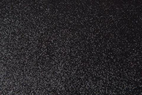 Silver sequins pattern. Sparkling sequins on black wool fabric as background Foto stock