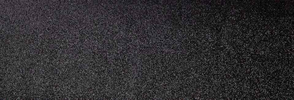 Silver sequins pattern. Sparkling sequins on black wool fabric as background Stock Photos