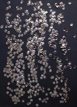 Silver sequins on violet background Foto stock