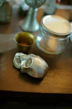 Silver Skull Object on Table Stock Photos