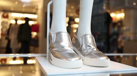 Silver sneakers on store display Video stock 40486606