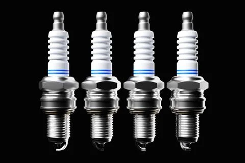 Silver spark plugs on black background. 3d illustration. Car Repair Parts Illustrazione stock