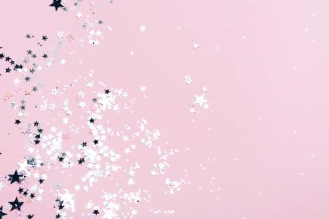 Silver sparkles on pink background Stock Photos