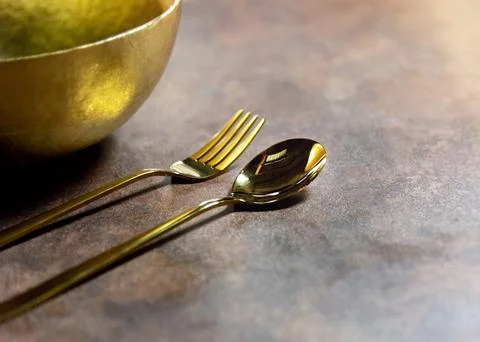 Silver spoon and silver fork at restaurant table Stock Photos
