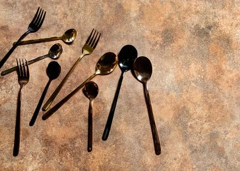 Silver spoon and silver fork at restaurant table Stock Photos