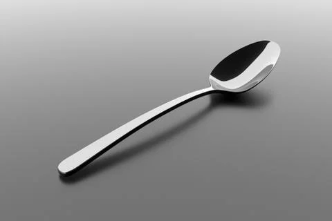 Silver spoon on a table Stock Illustration