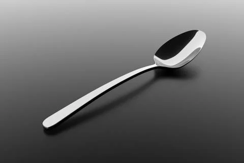 Silver spoon on a table Stock Illustration