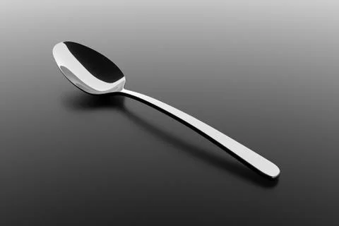 Silver spoon on a table Stock Illustration