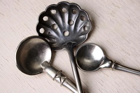 Silver Spoons on Cream Stock Photos