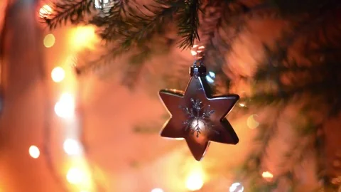 A silver star revolves on a Christmas tree Stock Footage 83042878