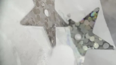 Silver Star Sequins Frozen in Ice Macro Abstract Background Video Stock Footage 333555697