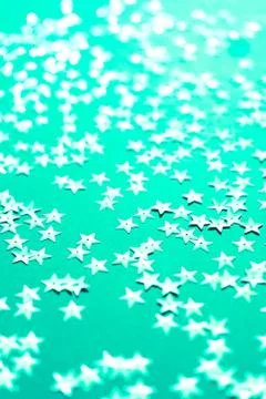 Silver star sparkles on mint backdrop. Festive Christmas concept Photos