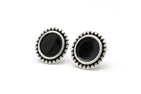 Silver stud earrings isolated on white Stock Photos