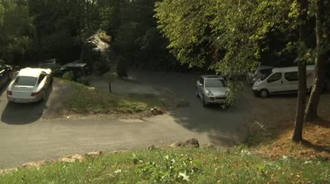 Silver SUV Driving Through Parking Lot in Carona, Switzerland Stock Footage 11881092